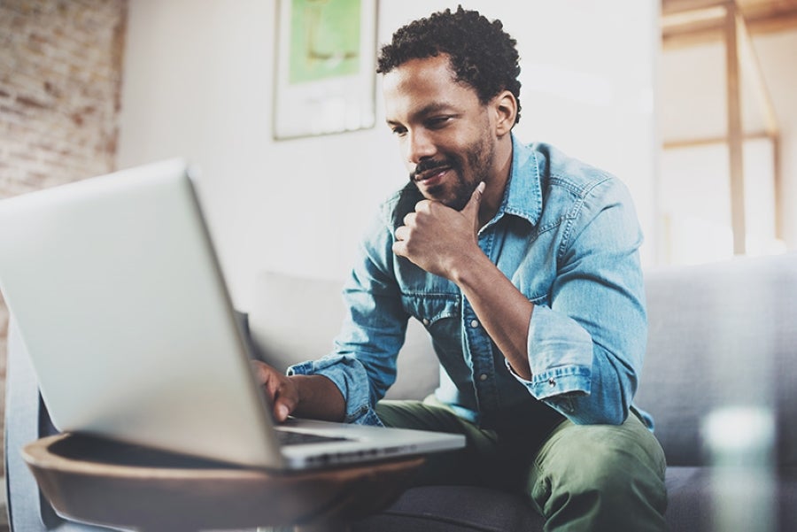 A young man using his laptop
